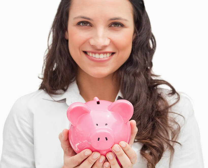 smiling woman holding a piggy bank