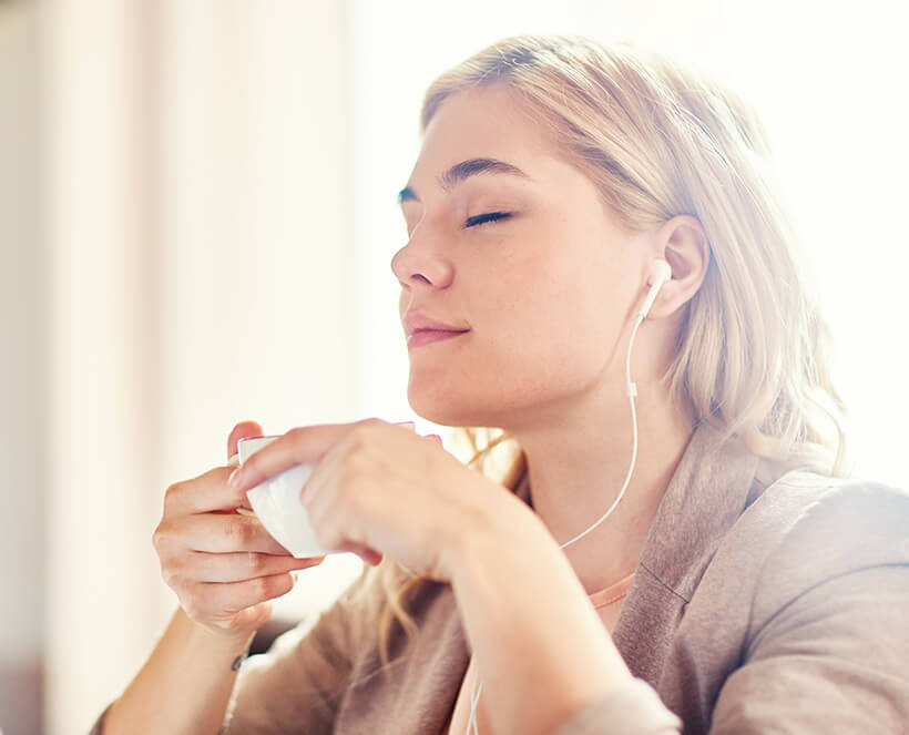 woman enjoying a hot cup of tea