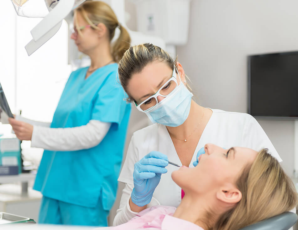 dentist examining a patient's teeth