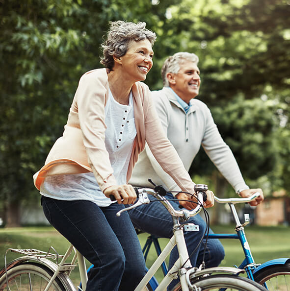 senior couple riding bikes together