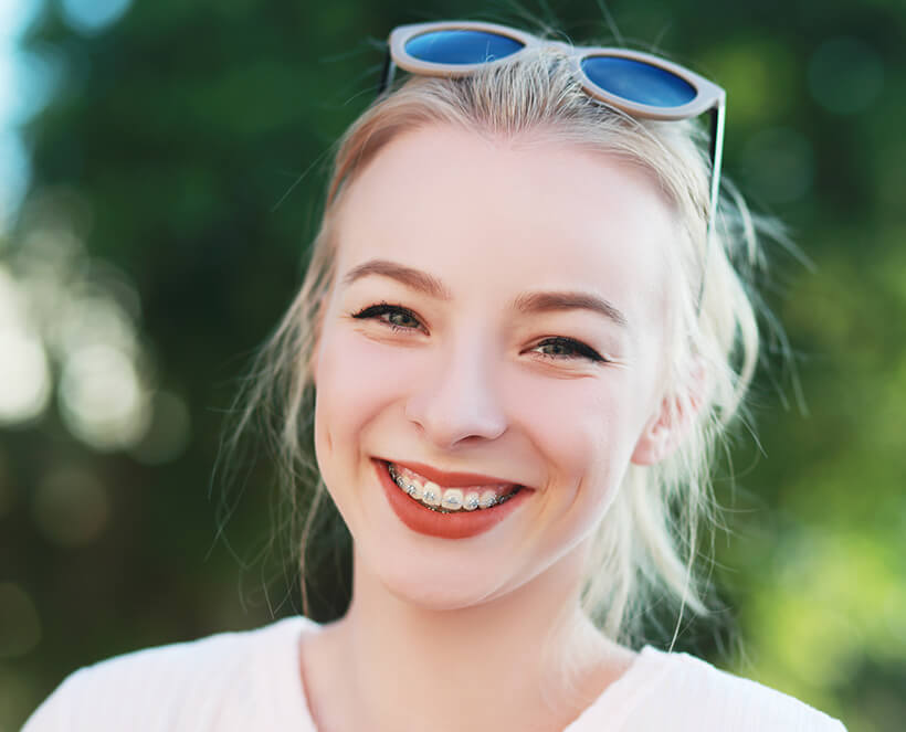 smiling girl with braces