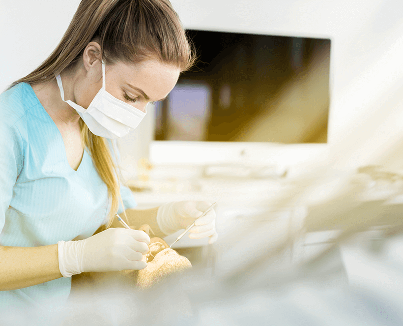 dental associate working on patient