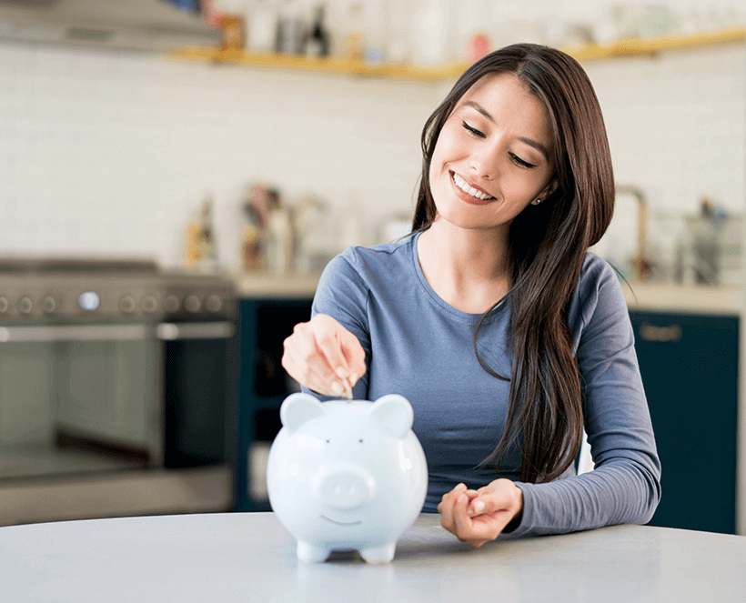 woman saving money in piggy bank