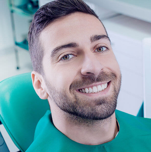 smiling man at the dentist