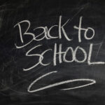 back to school written on a blackboard in chalk