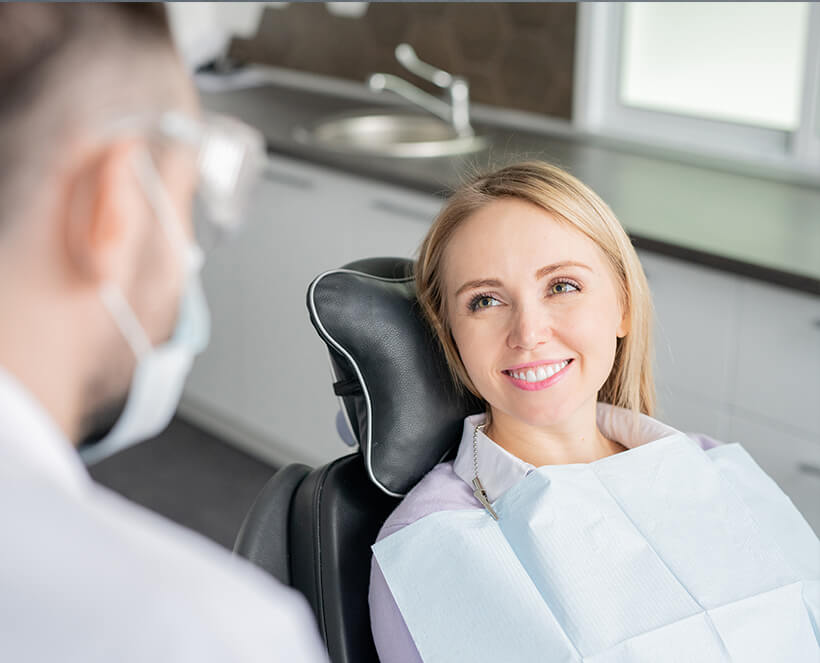 woman smiling at the dentist