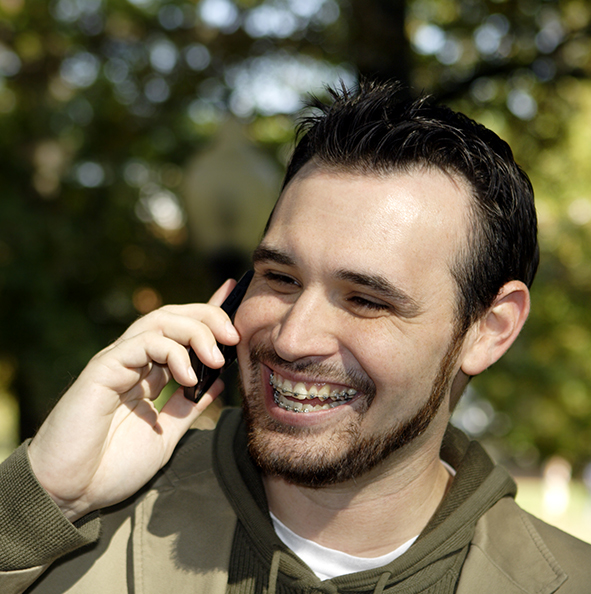 smiling man with braces