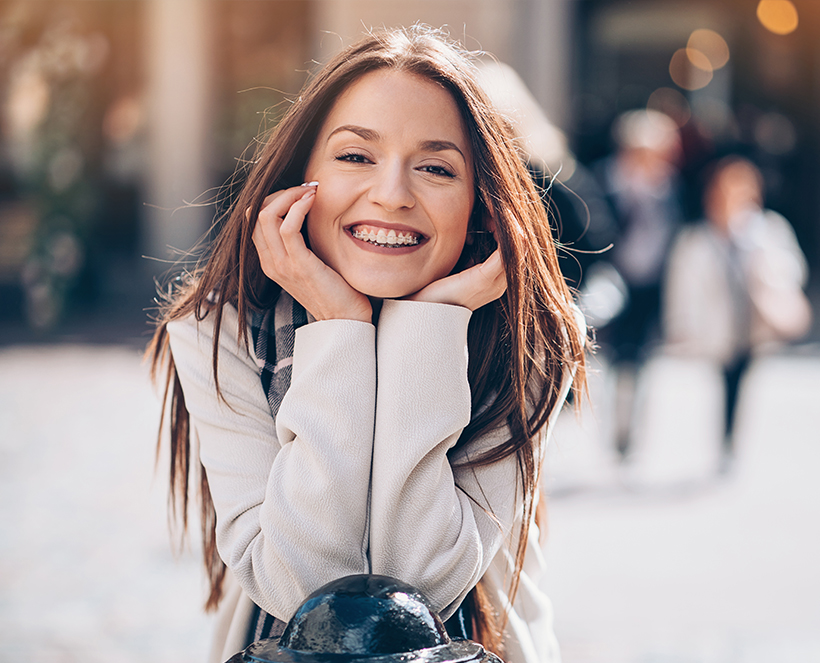 smiling woman with braces